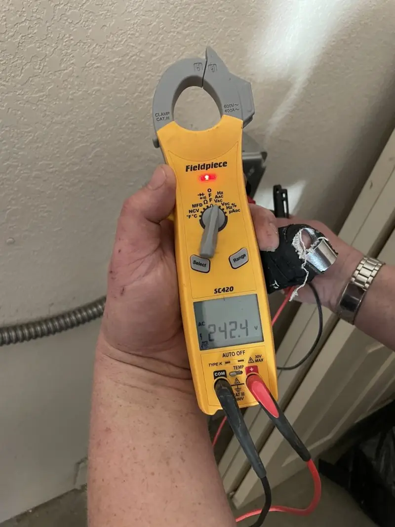Voltage testing with clamp meter during Generator Installation in Osceola